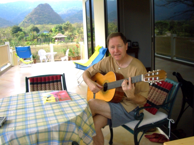 Jim Cook at his house in Thailand.  Still trying to learn to play the guitar