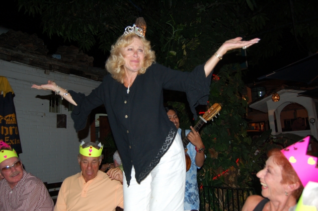 Marilyn Egolf, table Dancing in Mexico during 65th birthday party
